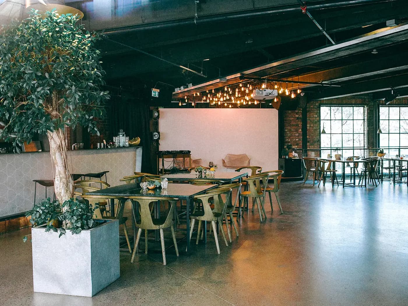 Restaurant dining area with tables, chairs and a clean hard floor