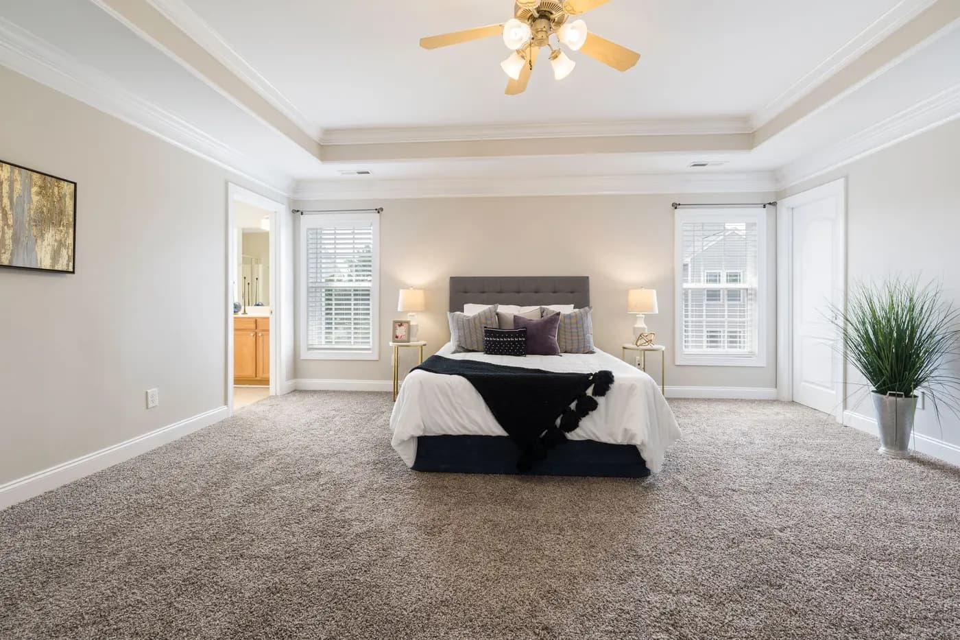 Bedroom with wall-to-wall carpet running through to the hallway